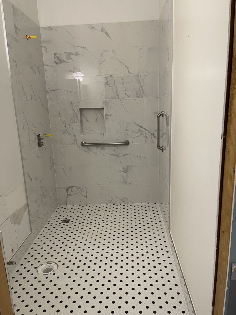 New walk-in shower with tile surround in a Suwanee bathroom remodel