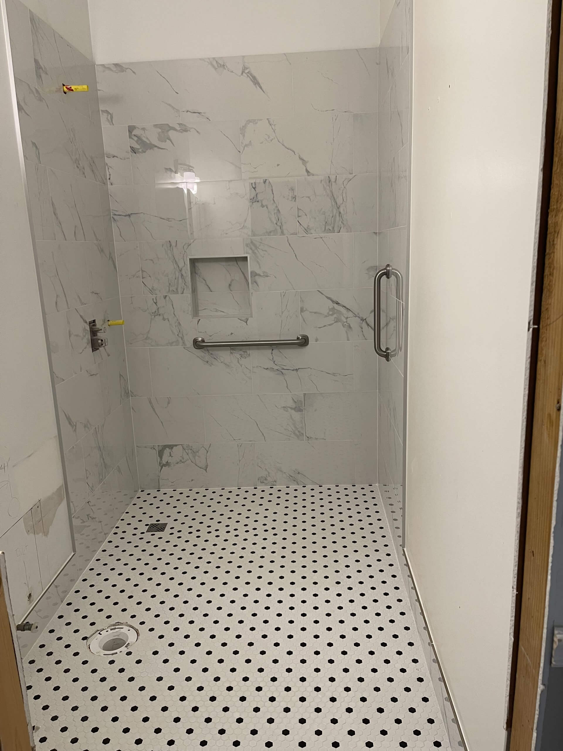 Remodeled primary bathroom shower with custom tile in Johns Creek Remodeled primary bathroom shower with custom tile in Johns Creek