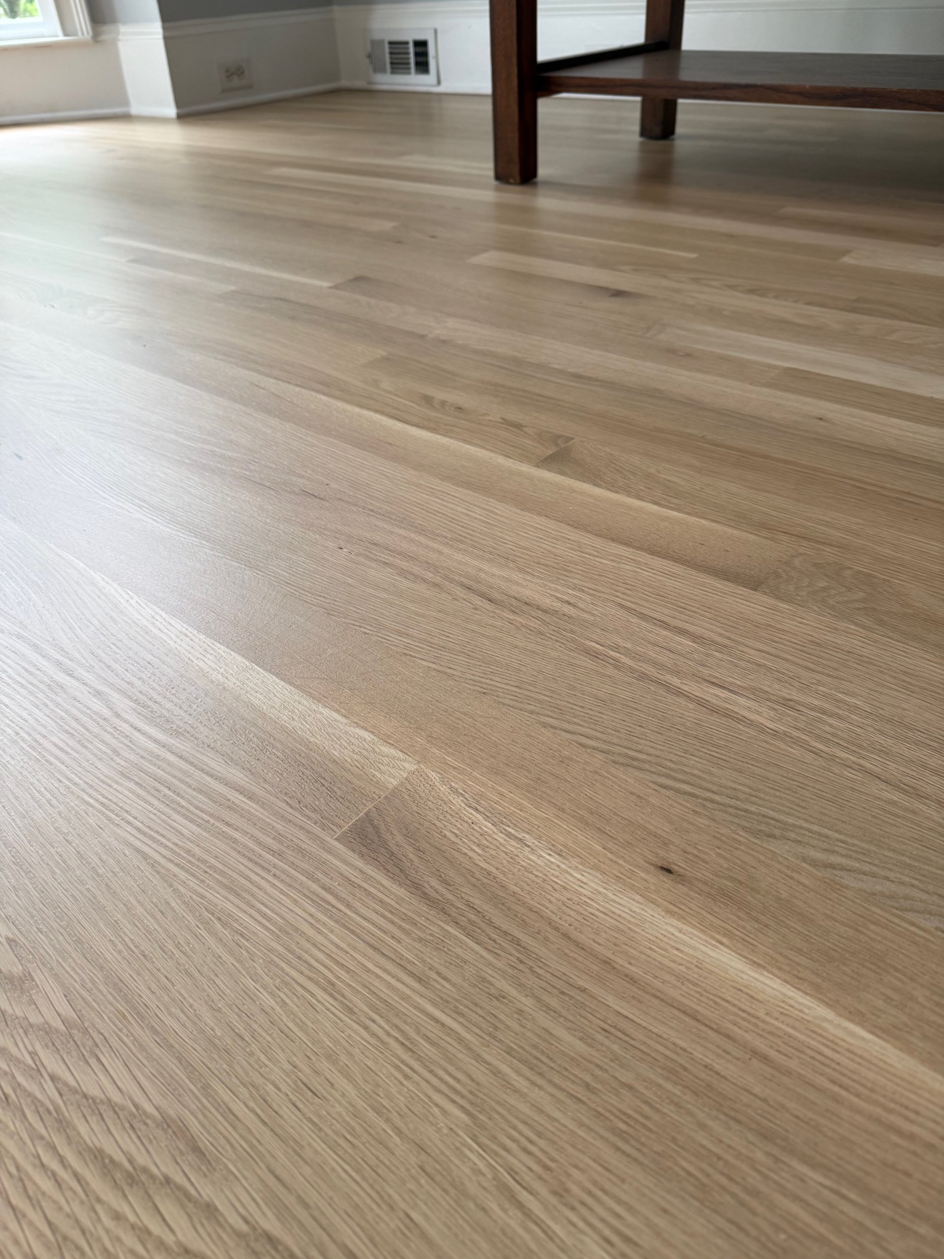 Close-up of newly installed and finished white oak flooring