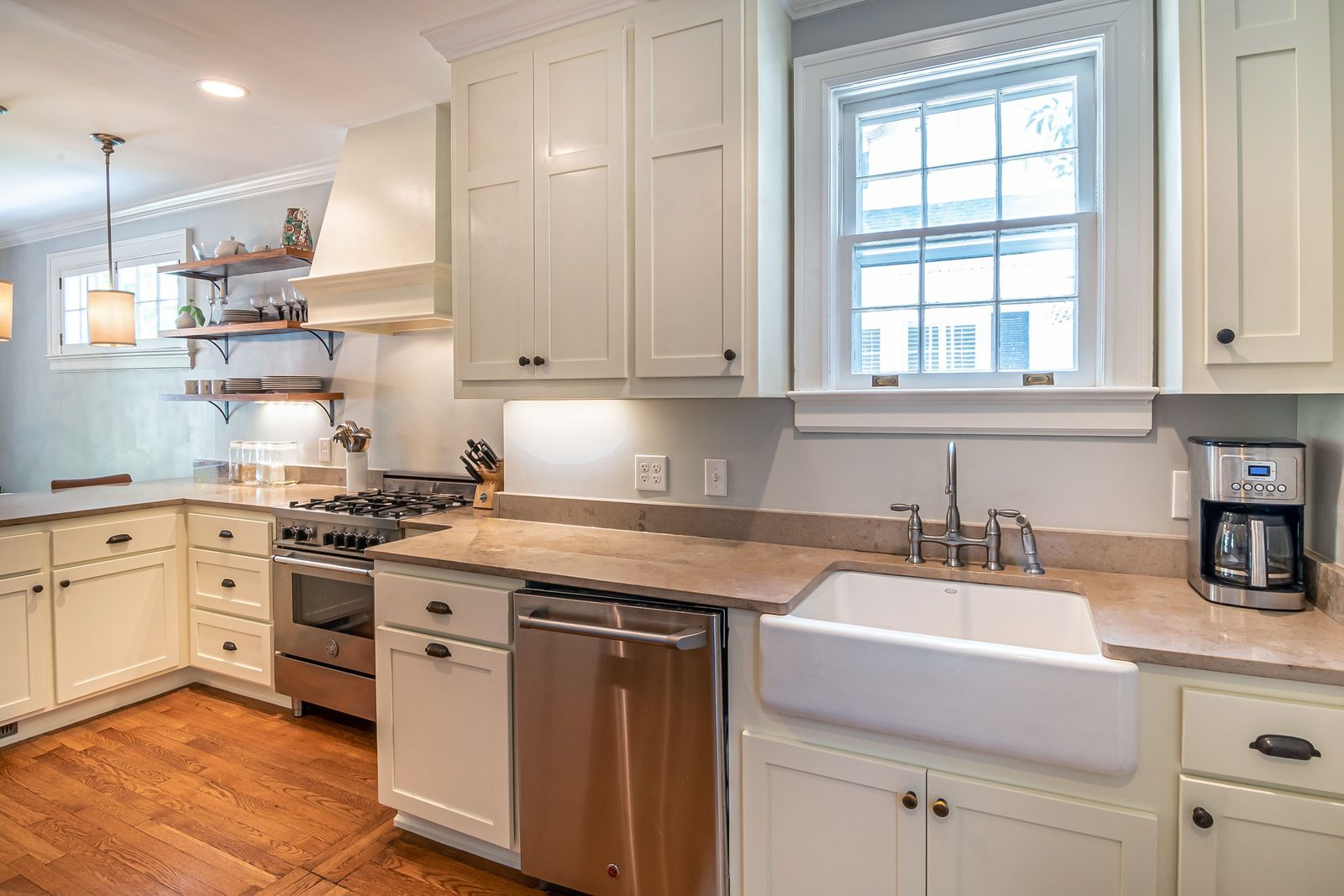 Bright kitchen with wooden floors and modern white cabinetry
