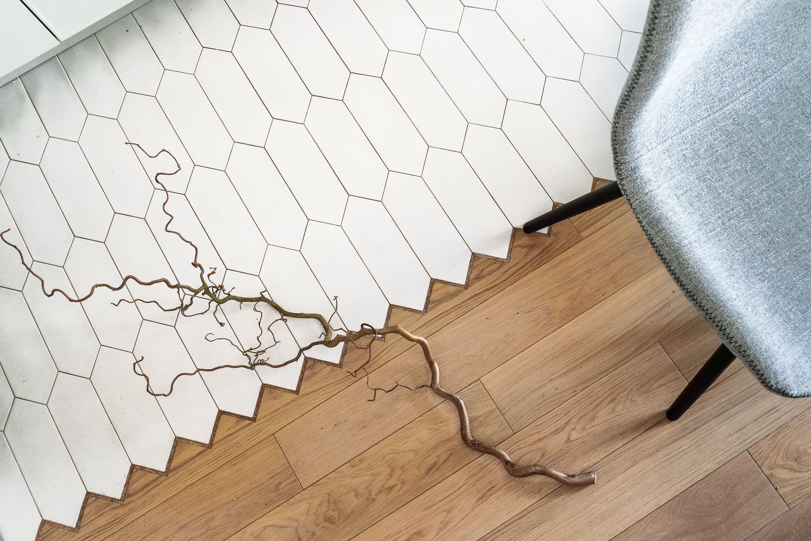 Overhead view of wood and tile flooring in a modern interior